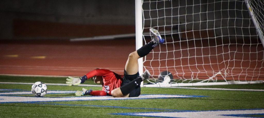 Senior Goalie Jesse  Montoya stops the ball in the first game against LEE Friday night. The Chargers won 2-1 at Commalander field. 